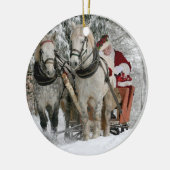 De kerstman rijdt in een paardje keramisch ornament (Links)