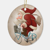 De kerstman rijdt met de fiets keramisch ornament (Links)