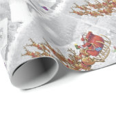 De kerstman rijdt op een slee met cadeaudoos cadeaupapier (Rol Hoek)