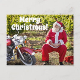 De kerstman rust met zijn kerst op de motorfiets briefkaart