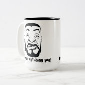 De Koksmann kijkt naar je. Tweekleurige Koffiemok (Voorkant links)