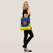 De kop van een Marigold-lori Tote Bag (Op model)