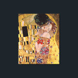 De Kus, Gustav Klimt Canvas Afdruk<br><div class="desc">Gustav Klimt De Kus (originele Der Kuss) is geschilderd door Gustav Klimt en is waarschijnlijk zijn bekendste werk. Hij begon er in 1907 aan te werken en het is het hoogtepunt van zijn zogenaamde 'Gouden Periode'. Het toont een paar, in verschillende tinten van goud en symbolen, het delen van een...</div>