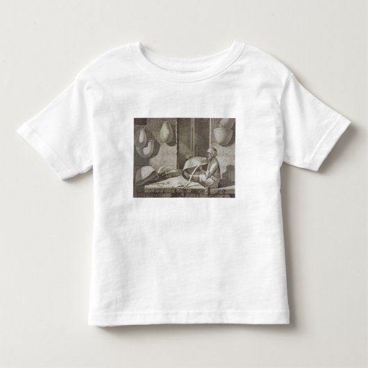 De mandenmaker, van boekdelen II en handelsartikel Kinder Shirts (Voorkant)