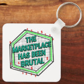 De marktplaats is wreed geweest sleutelhanger (Achterkant)
