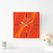 De oranje Laserstraal kijkt Lijnen op een Rode Vierkante Klok (Huis)