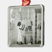 De overledene vergezeld door zijn zus metalen ornament (Links)