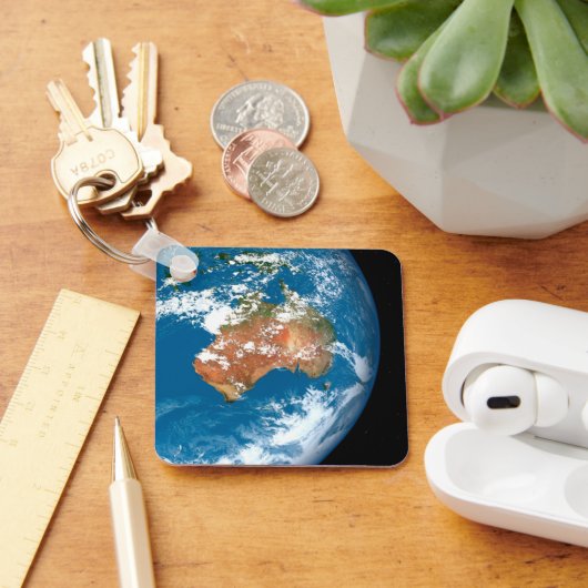 De planeet Aarde toont wolken boven Australië. Sleutelhanger (Bureau)