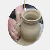 De pottenbakker en de klei keramisch ornament (Links)