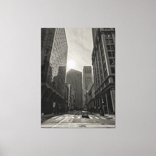 De rijzende zon boven de stad canvas afdruk (Voorkant)