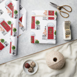 De rode kerstdeur voor feestdagen is verpakt papie cadeaupapier