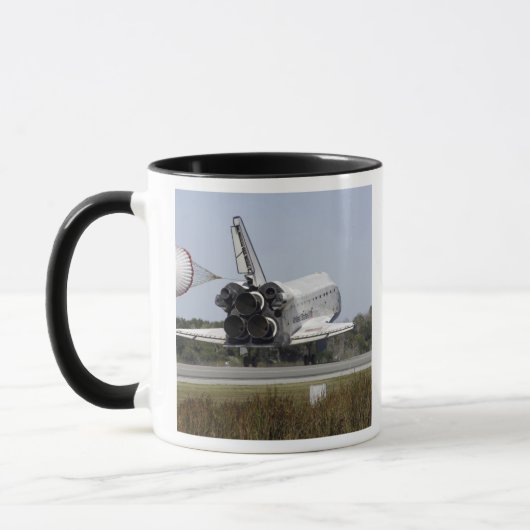 De ruimtependelAtlantis ontruimt zijn belemmerings Mok (Links)