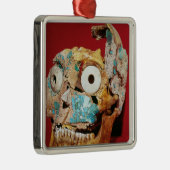 De schedel is versierd met een mozaïek in turkoois metalen ornament (Rechts)