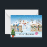 De Snowman achter de kerstkaart Notitiekaartje<br><div class="desc">kerstkaart met afbeelding van de sneeuwman achter het hek</div>