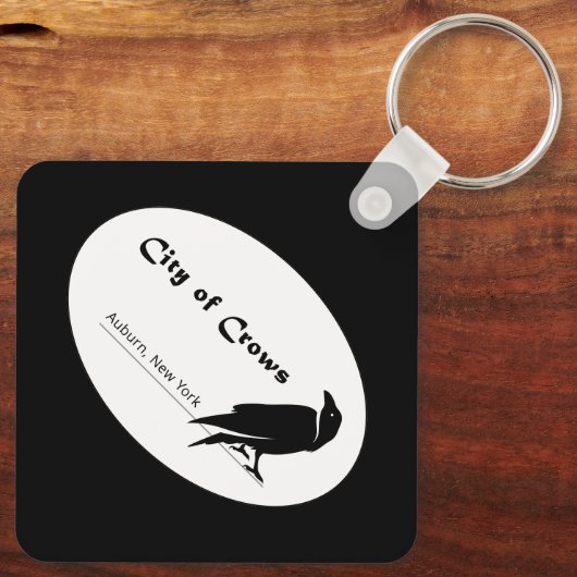 De stad van de kraaien Logo Sleutelhanger (Achterkant)