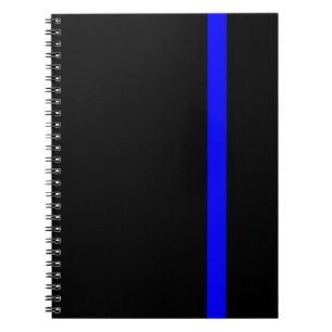 De symbolische dunne blauwe lijn op zwart notitieboek