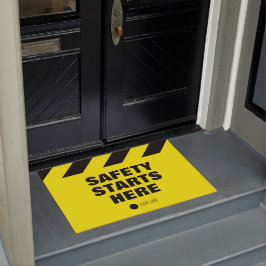 De veiligheid op het werk begint hier met een gele deurmat