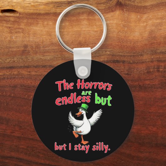 De verschrikkingen zijn eindeloos, maar ik blijf G Sleutelhanger (Voorkant)