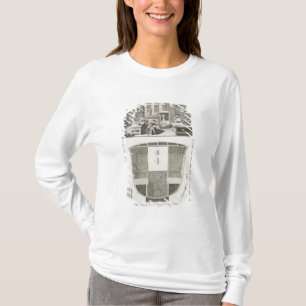 De vervaardiging van een sedanstoel in een coachbu t-shirt