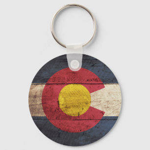 De vlag van de staat Colorado op de oude houten ko Sleutelhanger