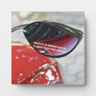 De voorwerpen van het Effect Mandela in spiegel ku Fotoplaat