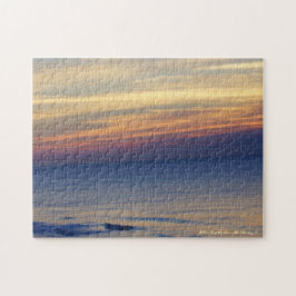 De zon boven de oceaan legpuzzel