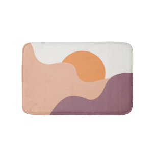 De zon gaat onder achter de paarse heuvels badmat