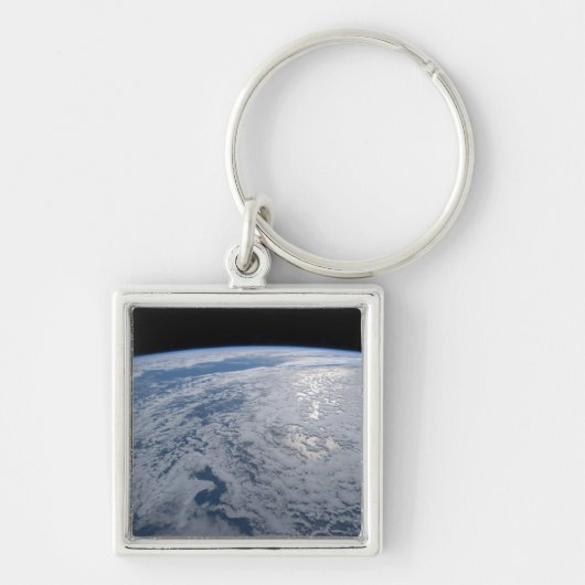 De zon straalt uit op de Stille Zuidzee. Sleutelhanger (Voorkant)