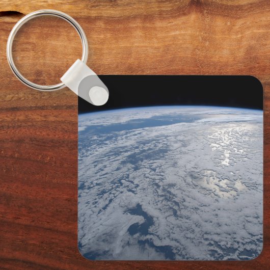 De zon straalt uit op de Stille Zuidzee. Sleutelhanger (Voorkant)