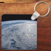 De zon straalt uit op de Stille Zuidzee. Sleutelhanger (Achterkant)