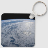 De zon straalt uit op de Stille Zuidzee. Sleutelhanger (Achterkant)