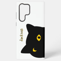 De zwarte kat die je met gouden ogen bekijkt op ma