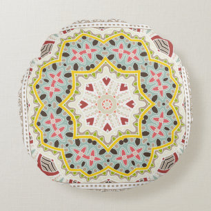 Decoratieve kleurrijke versiering op witte achterg rond kussen