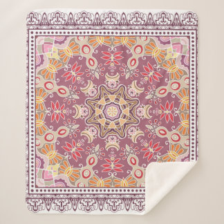 Decoratieve kleurrijke versiering op witte achterg sherpa deken