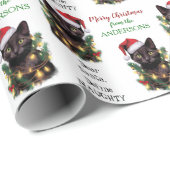 Definieer ondeugende kat die in kerstverlichting i cadeaupapier (Rol Hoek)