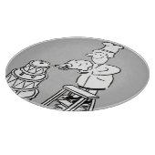 Dekmaker die een reuzengekleurde heek decorbeert snijplank (Hoek)