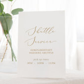 Delicate gouden kalligrafie bruiloft shuttle servi reclamebord met voetstuk