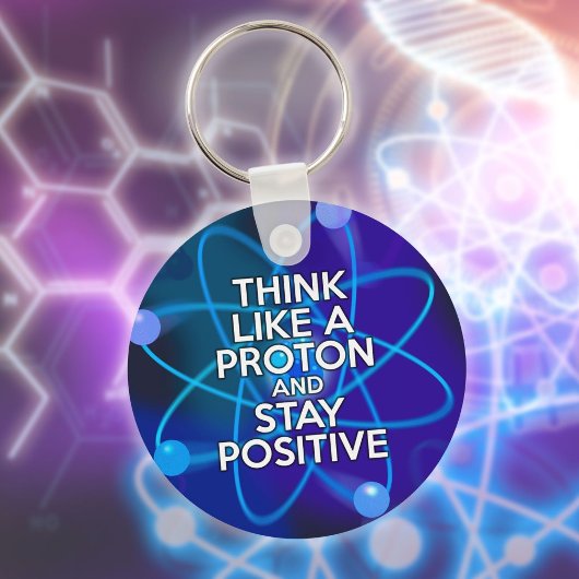 Denk als een proton en blijf positief leuk citaat sleutelhanger