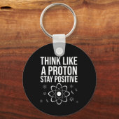 Denk als een proton positief blijft sleutelhanger (Voorkant)