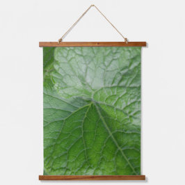 Detail van de groenbladader hangend wandkleed