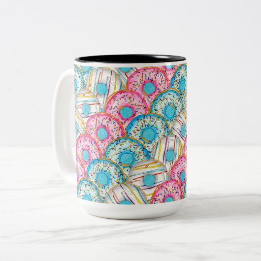 Diagonaal gestapelde waterverf donuts op blauwgroe tweekleurige koffiemok (Voorkant links)
