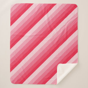 diagonaalstrepen van Ombre, rood tot roze tonen Sherpa Deken