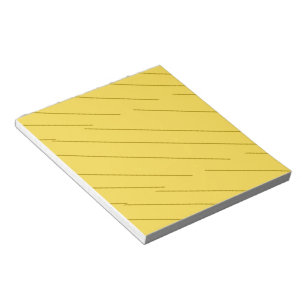 Diagonale bruine strepen op mosterdgeel notitieblok