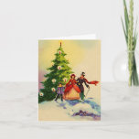 Dickens style Christmas illustration Kaart<br><div class="desc">Old English Dickens style Christmas illustration with a family standing in the snow in front of a Christmas tree with bright burning candles.</div>