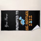 Dinosaur Egg Hatching promoot aan Big Brother Strandlaken (Voorkant)