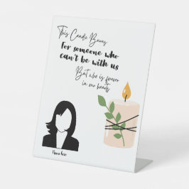 Dit kaarsje brandt ter herinnering aan voetstuk si reclamebord met voetstuk