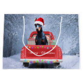 Doberman Dog in sneeuw, met Kerstmis Groot Cadeauzakje (Voorkant)