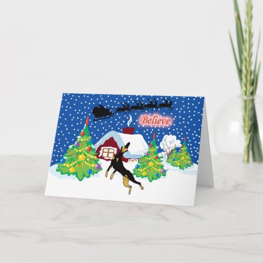 Doberman gelooft in Kerstmis van de Kerstman Feestdagen Kaart (Voorkant)