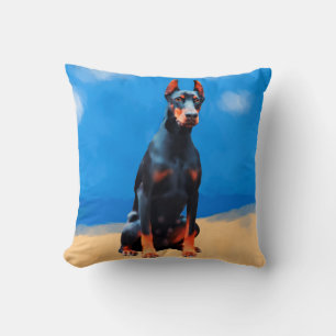Doberman hond zitten op het strand kussen