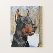 Doberman pinscher in de sneeuw legpuzzel (Verticaal)
